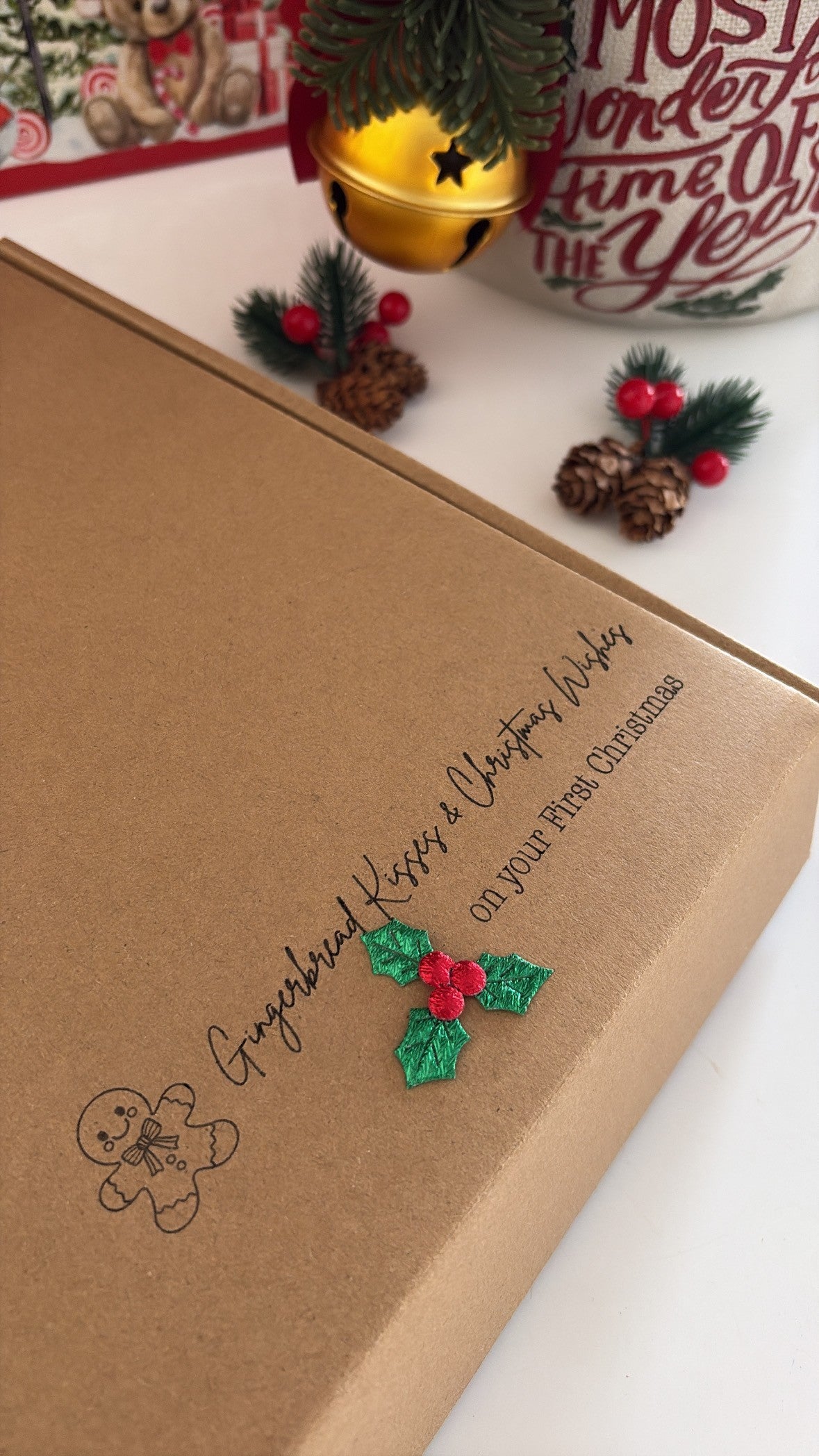 Cute baby’s first Christmas gift set presented in a kraft box with festive packaging