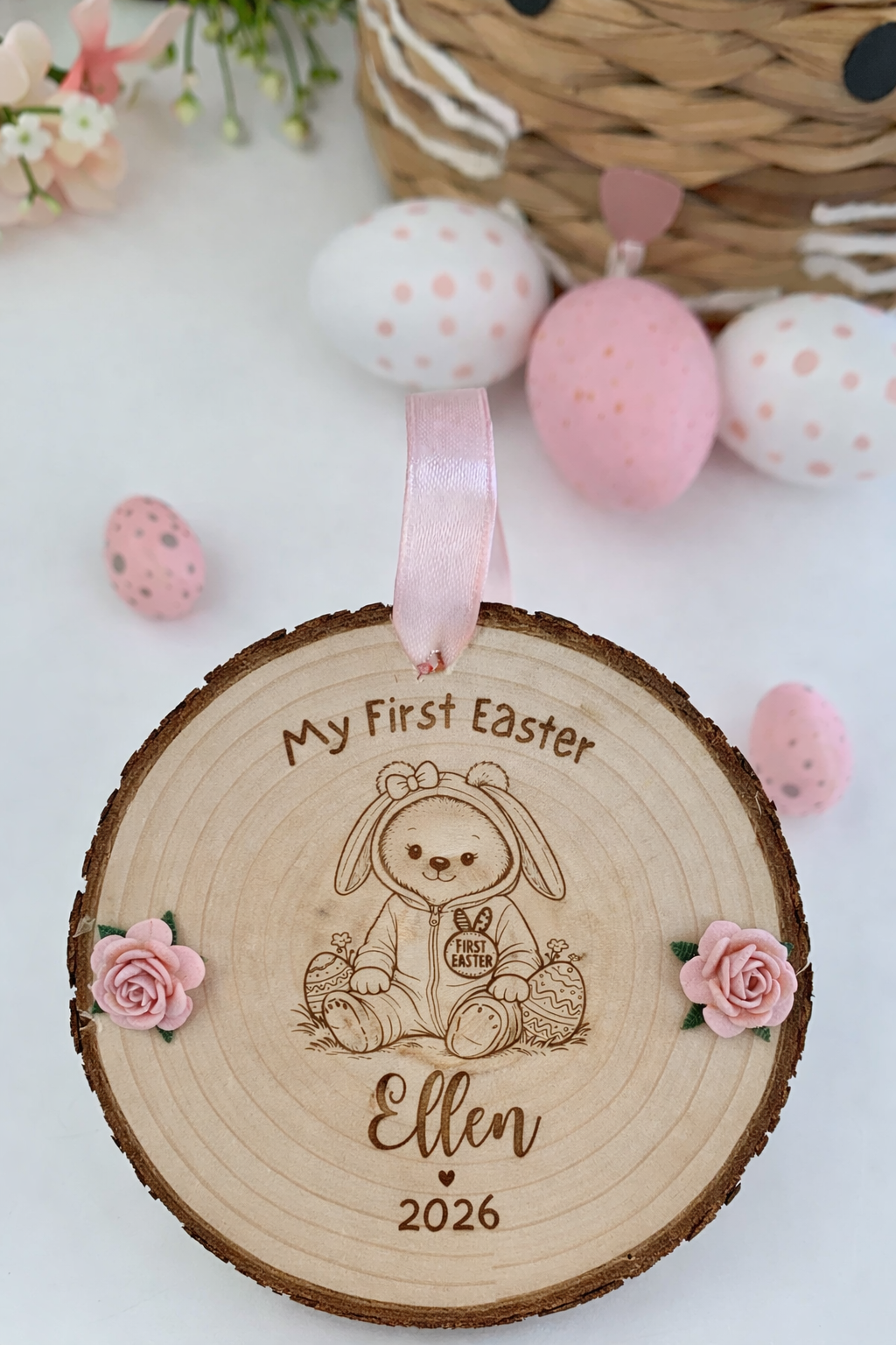 Wooden ornament with 'My First Easter' engraving, teddy bear illustration, and decorative eggs on a white background.