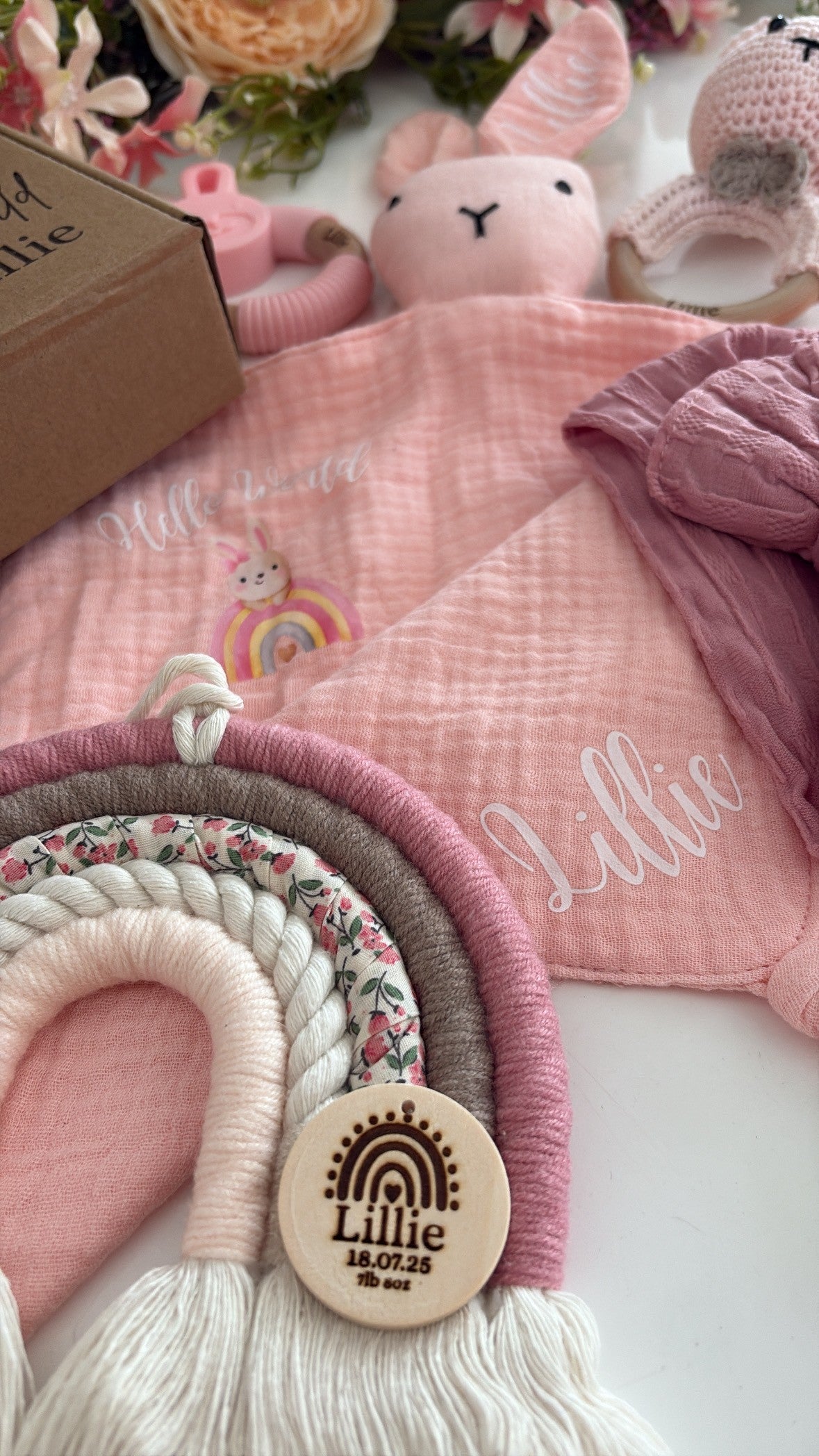 Personalised blush and taupe macramé rainbow with floral fabric and engraved wooden name tag — handmade baby gift.
