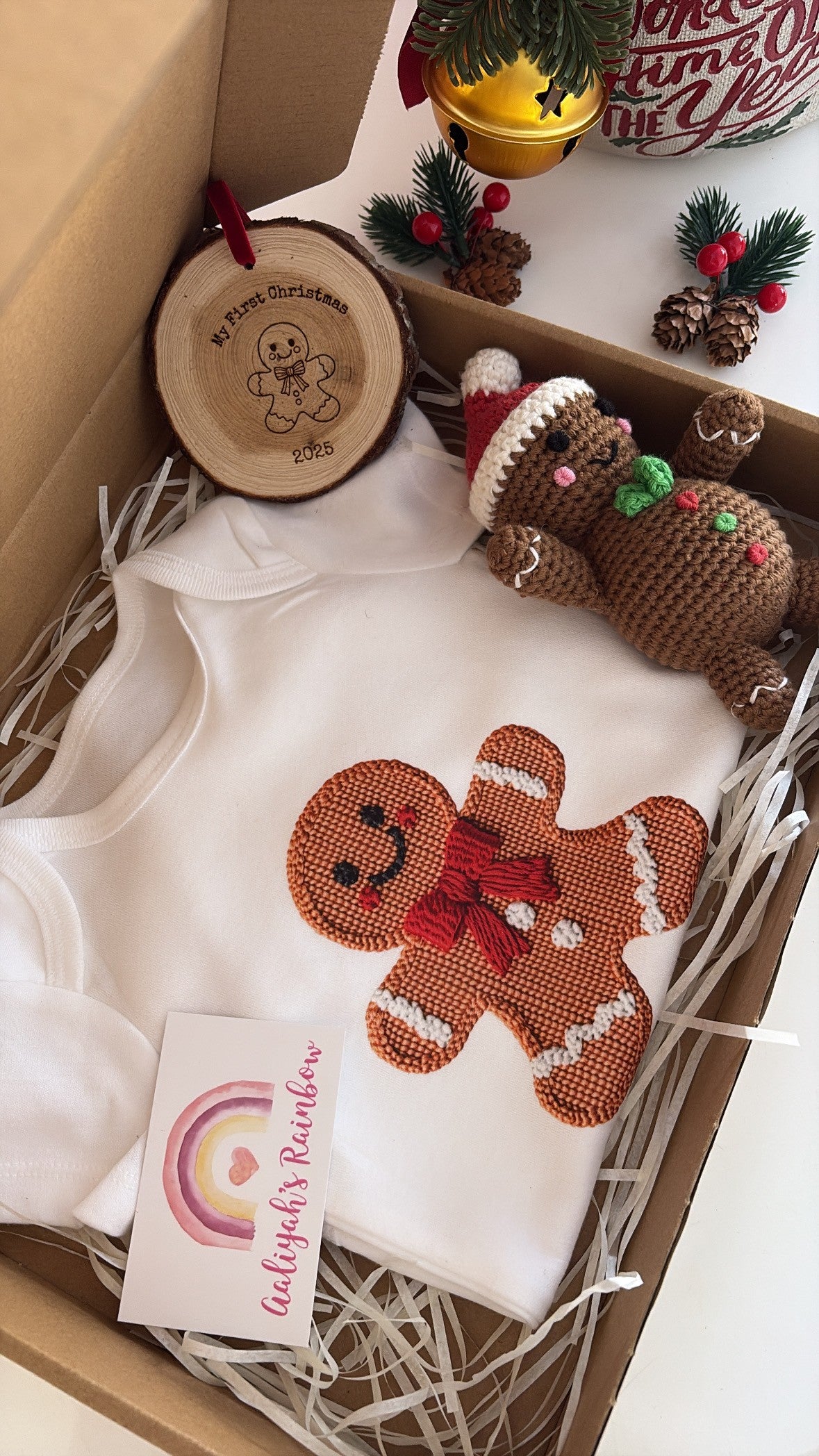 Gingerbread baby gift box with bodysuit, crochet toy, and My First Christmas 2025 ornament