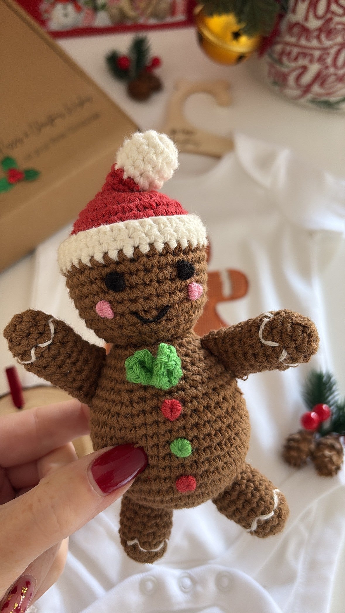 crochet gingerbread toy with baby bodysuit and engraved wood ornament