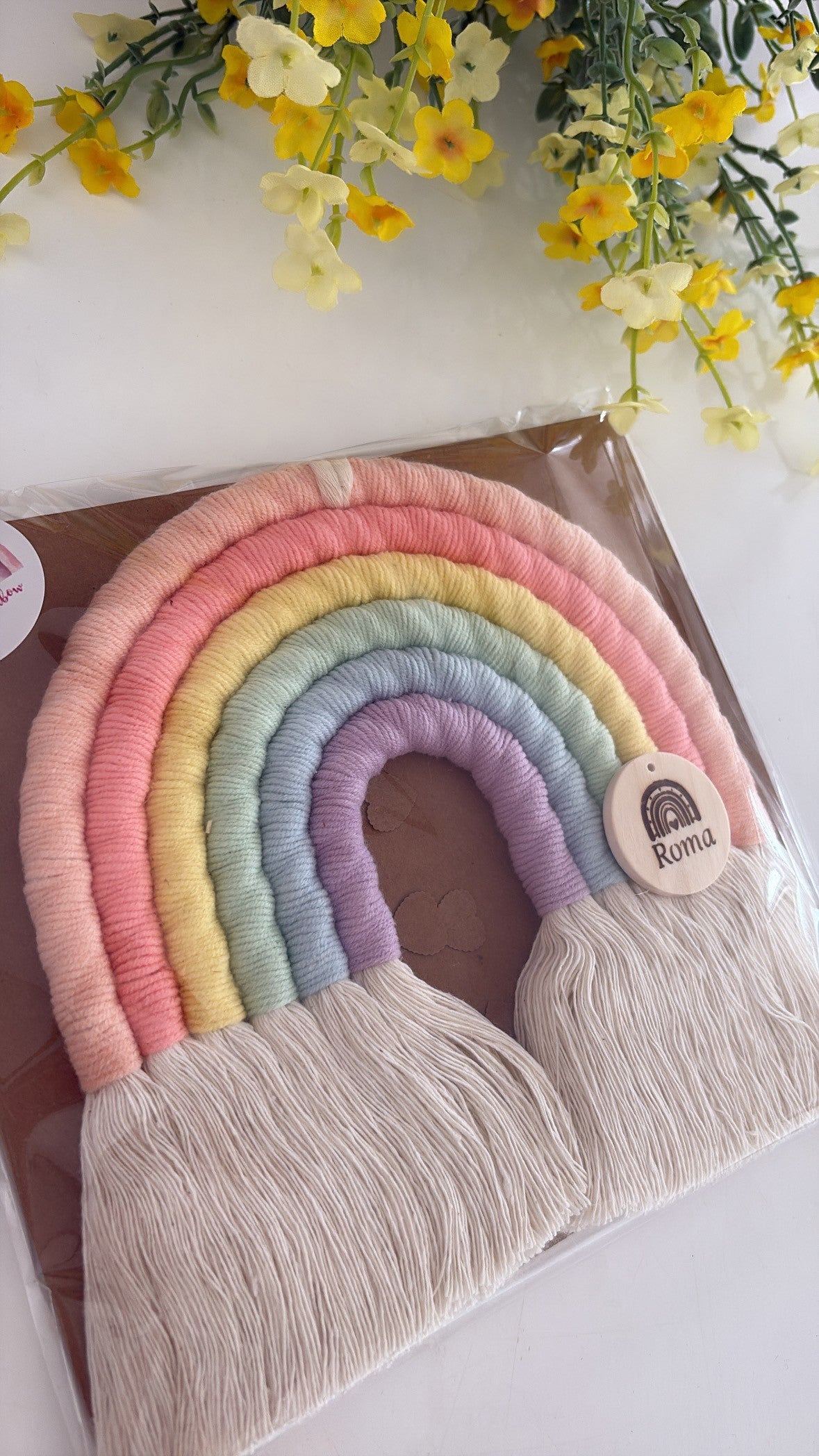 Personalised macramé rainbow in soft pastel colours — handmade baby gift and nursery keepsake