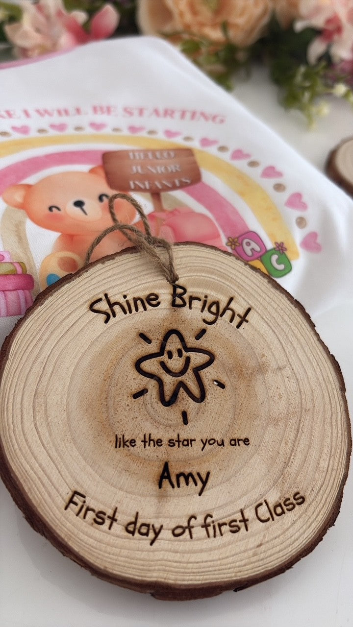 Natural wooden keepsake disc engraved with the words "Shine Bright like the star you are" and a smiling star illustration, handcrafted by Aaliyah's Rainbow for first day of school celebrations.