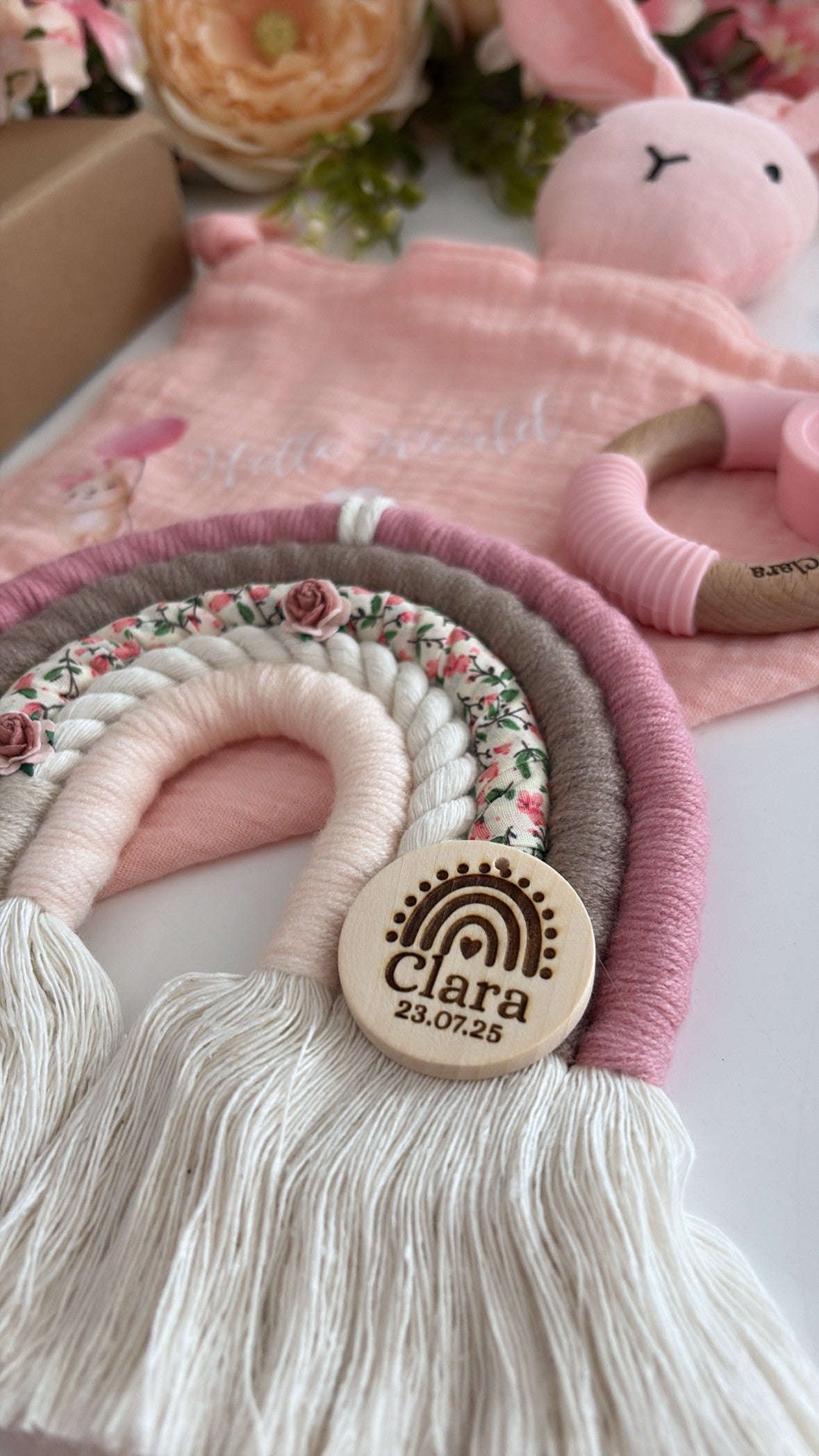 Personalised blush and taupe macramé rainbow with floral fabric and engraved wooden name tag — handmade baby gift.